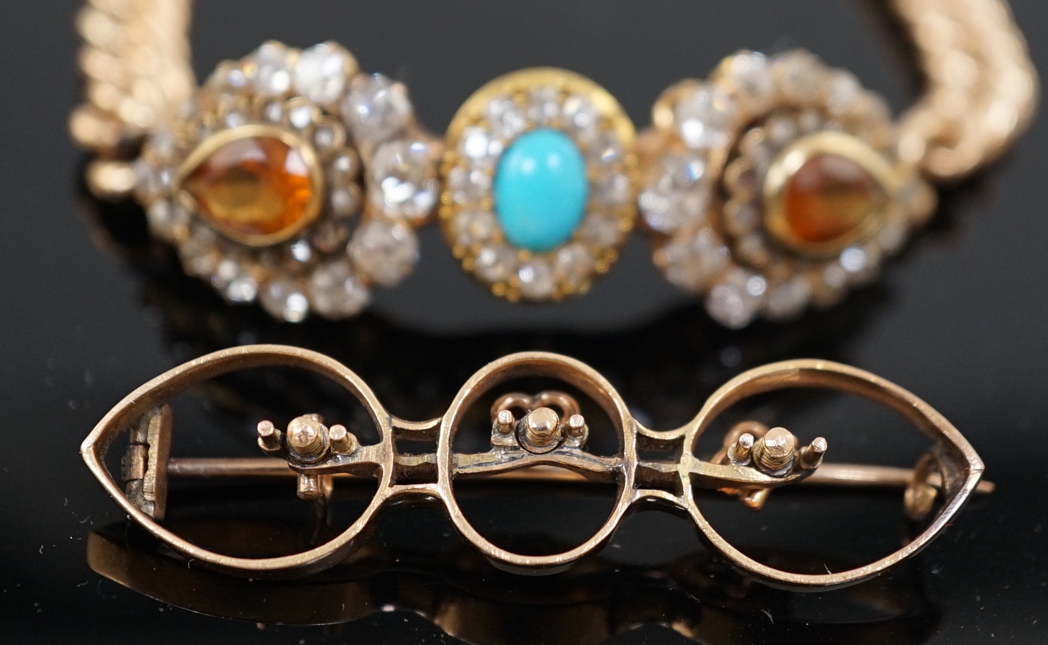 An Edwardian 15ct gold, citrine, turquoise and diamond set triple cluster set curblink bracelet